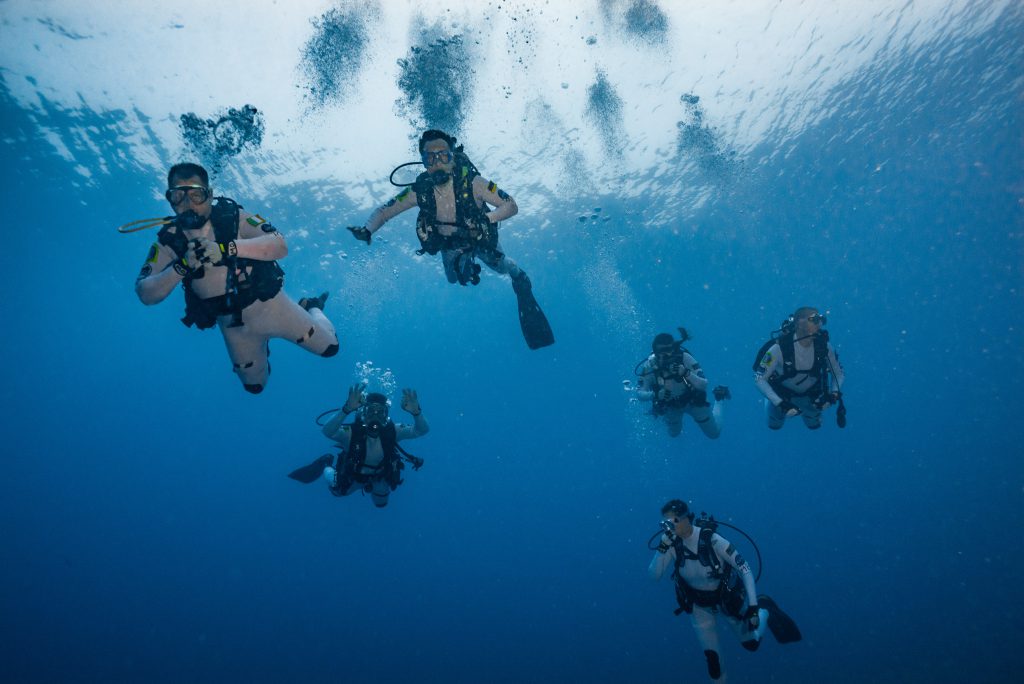 The crew descends to the habitat for splash down