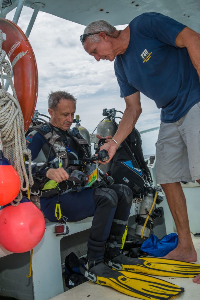 Otto Rutten prepares Herve' Stevenin for a support dive on Aquarius