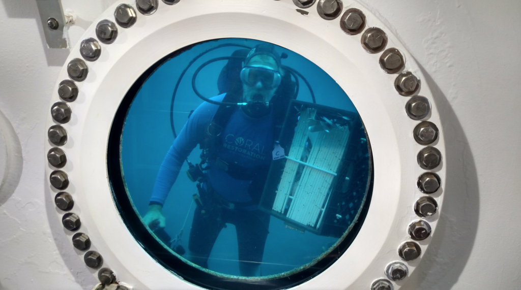 Coral Restoration Foundation Founder and President Ken Nedimyer delivering coral nursery supplies for the day's EVA